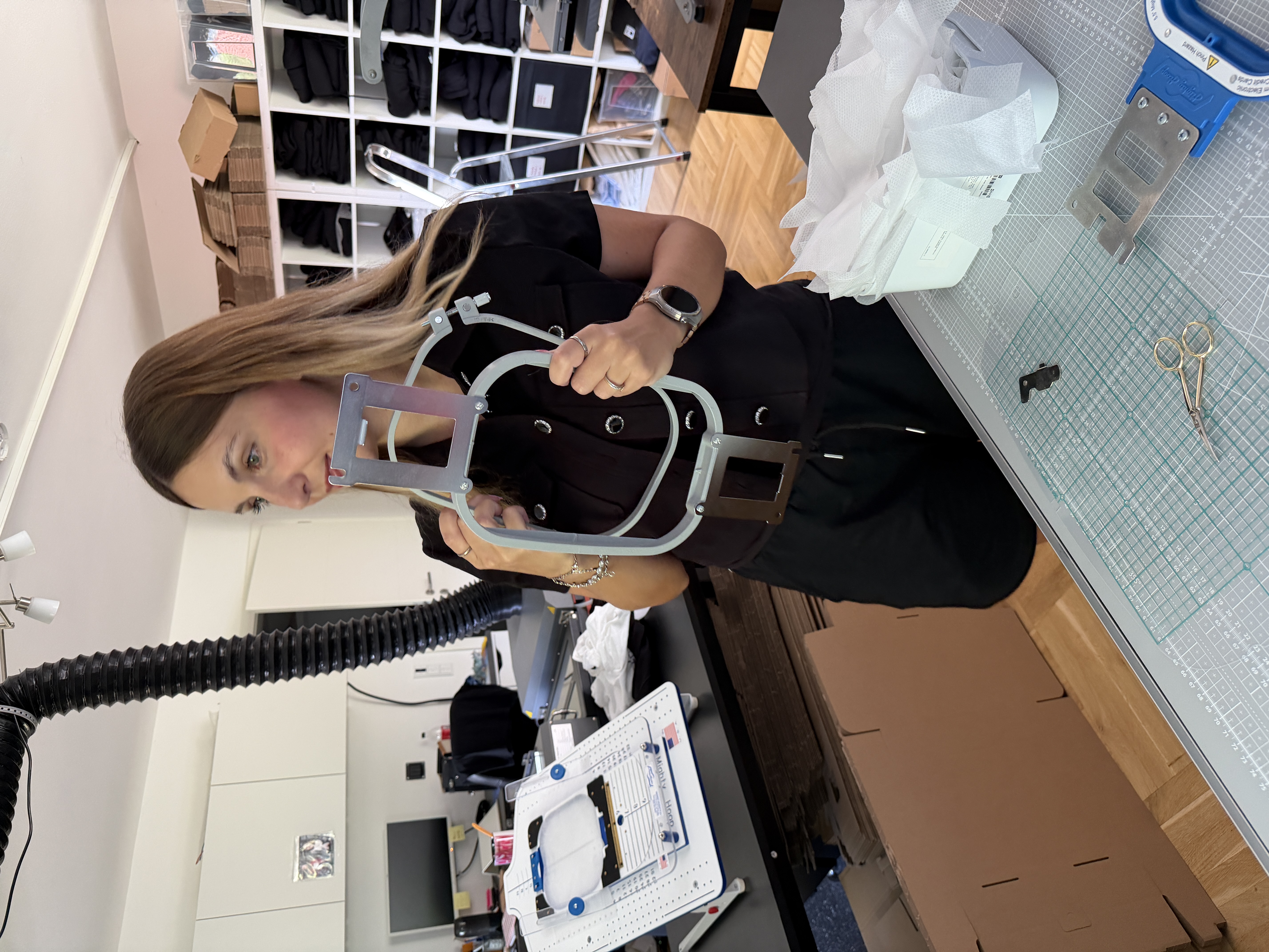 Lara Uschakow preparing embroidery hoops, stabilizer and textiles for a larger embroidery order